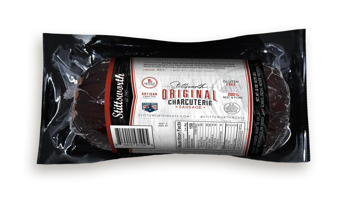 A 12 oz chub of Stittsworth Original summer sausage, dark and smooth, in a black vacuum-sealed wrapper with a red-trimmed label.
