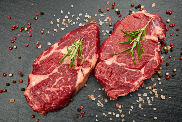 Fresh-cut chuck eye steak with marbling and rosemary — Stittsworth Meats, Bemidji MN